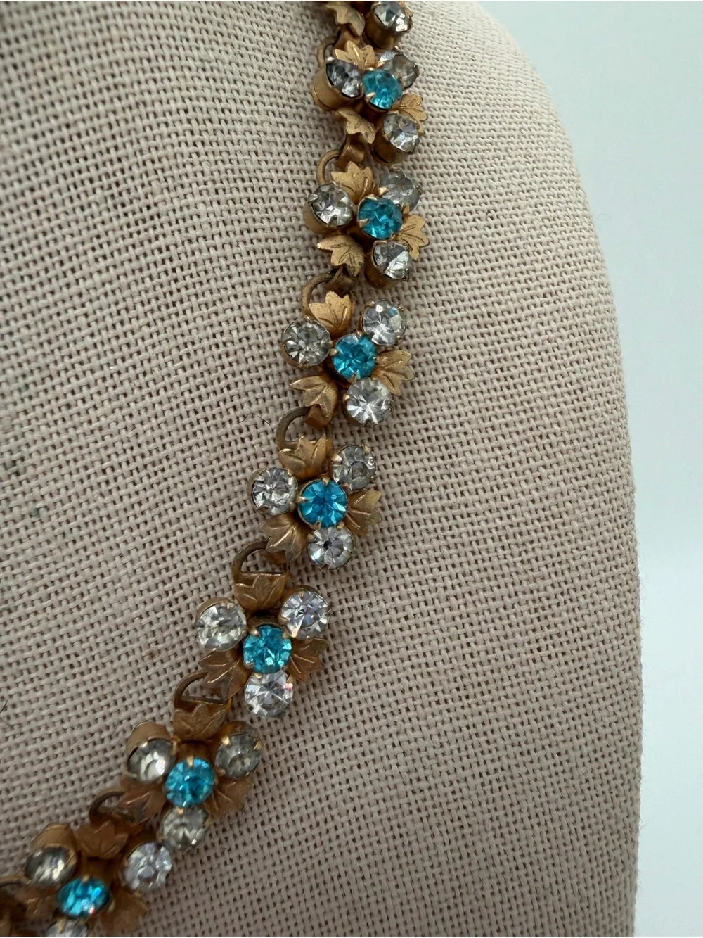 Vintage gold tone blue and clear rhinestone flower necklace